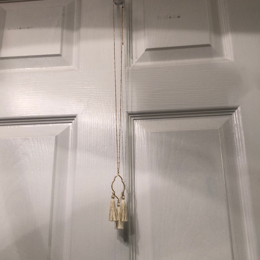 Long gold necklace with tassles